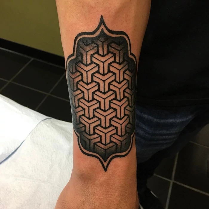 Mandala pattern forearm, wrist tattoo done in black and grey ink by tattoo artist Russ Howie of Sacred Mandala Studio in Durham, NC.